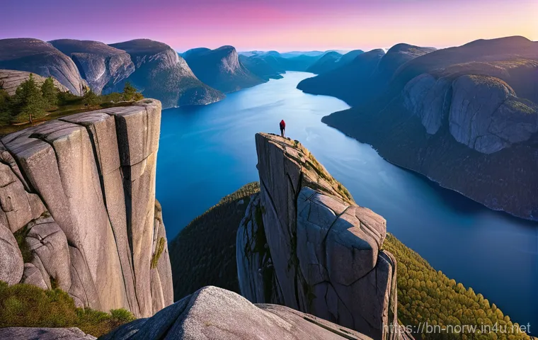 노르웨이 하이킹 코스 추천 - **Preikestolen at Golden Hour:** A breathtaking wide shot of Preikestolen (Pulpit Rock) in Norway, b...